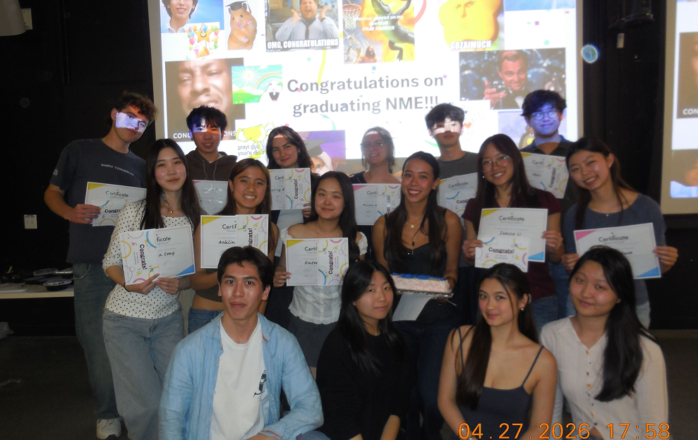 The full NME team posing with certificates after the showcase